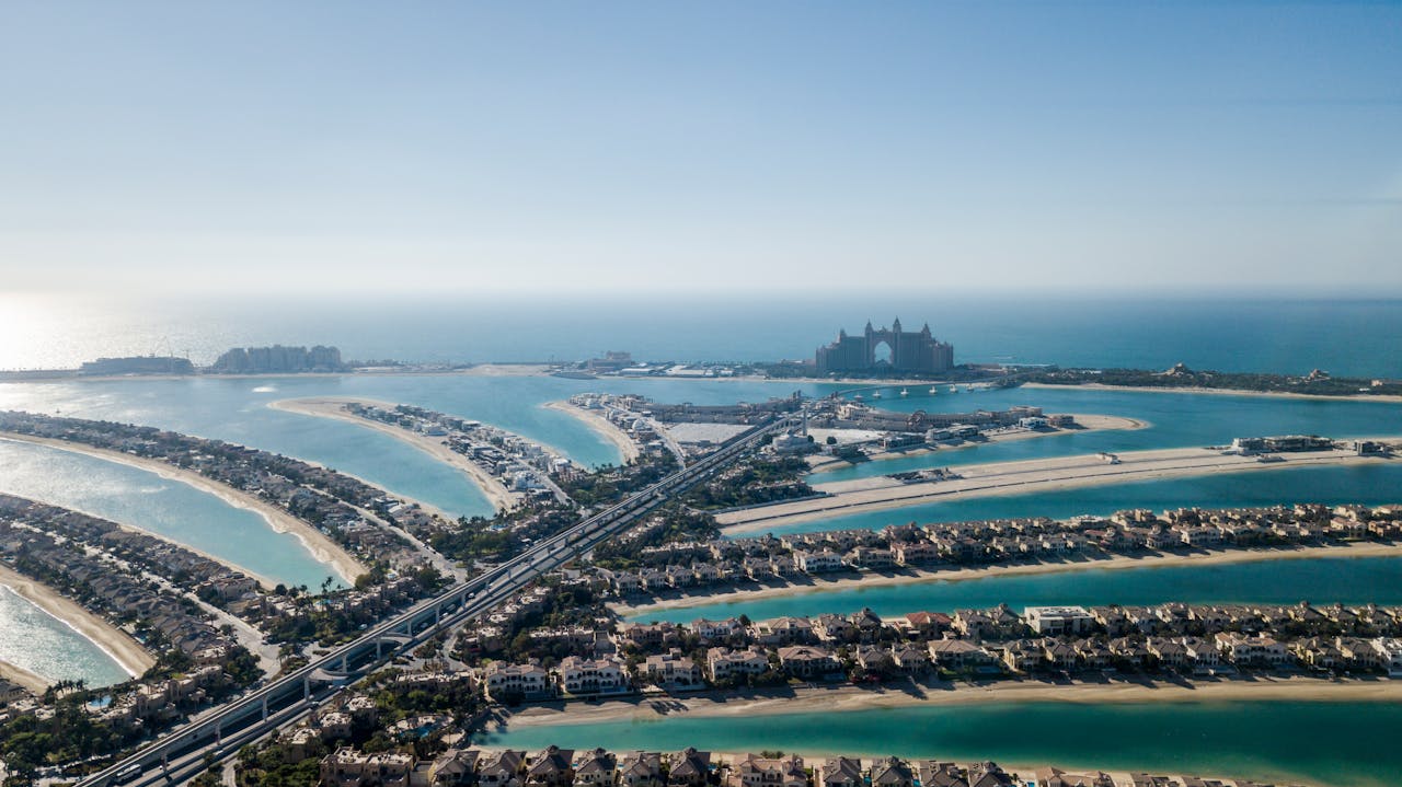 services-01 Stunning aerial view of Palm Jumeirah, an iconic artificial archipelago in Dubai, UAE.