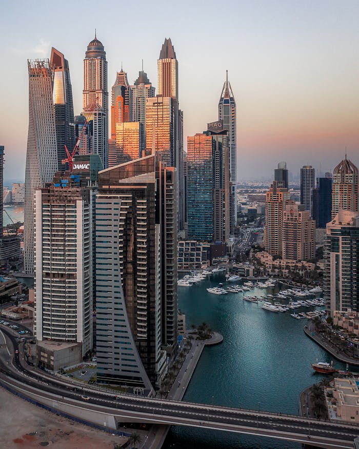 Captivating aerial photograph of Dubai Marina highlighting its iconic skyscrapers during sunset.