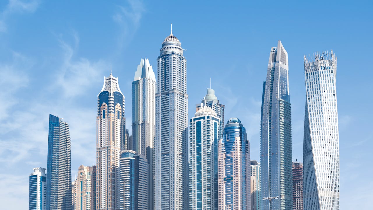 services-02 Stunning view of Dubai's iconic skyscrapers under a clear blue sky.